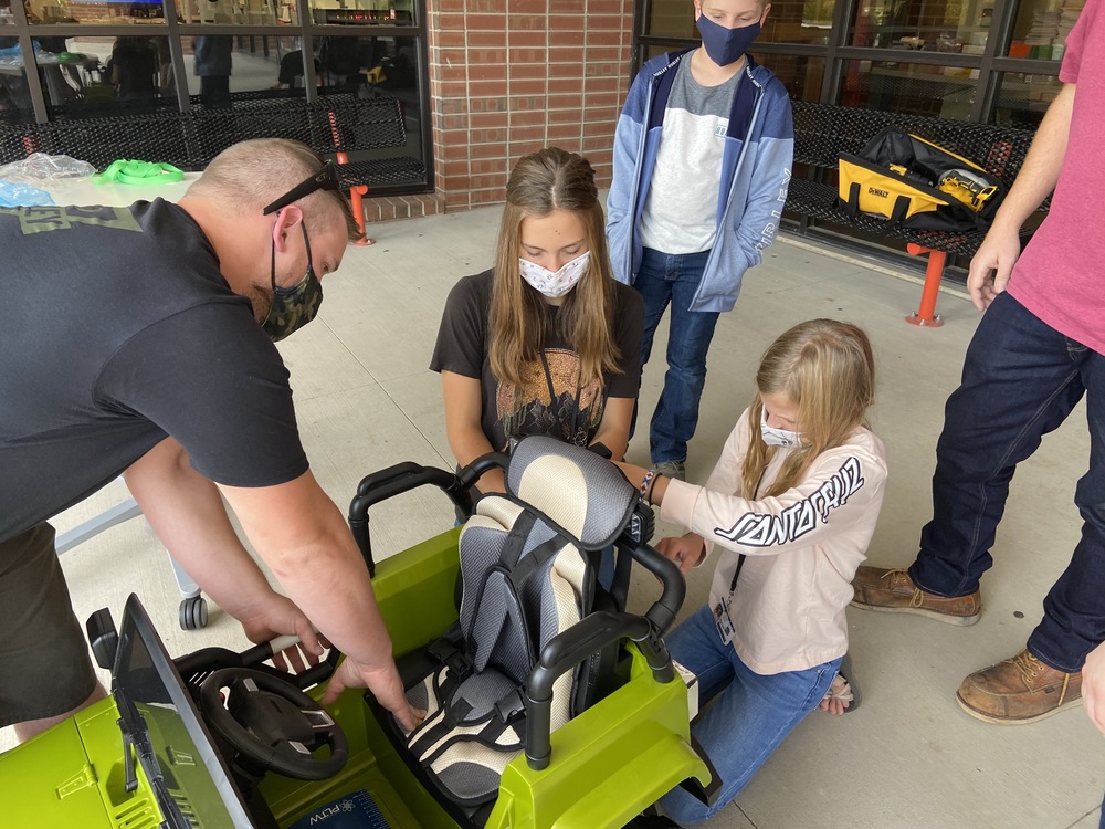 EMS students and engineering mentors are modifying 12 volt vehicles for toddlers who move differently.