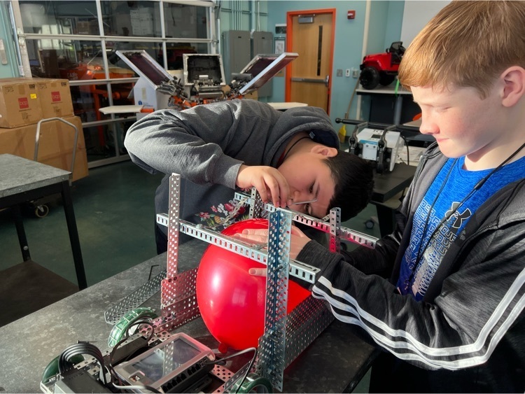 Automation & Robotics Students Working on Robot