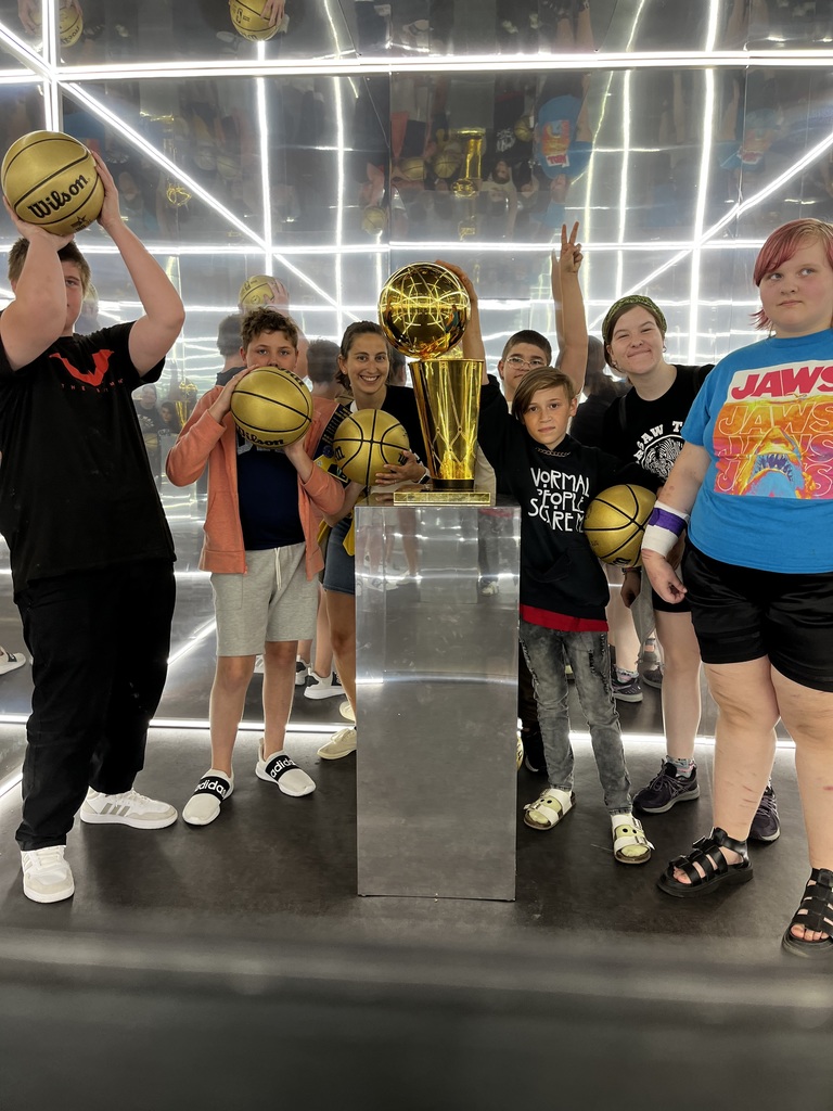 Students pose with basketballs