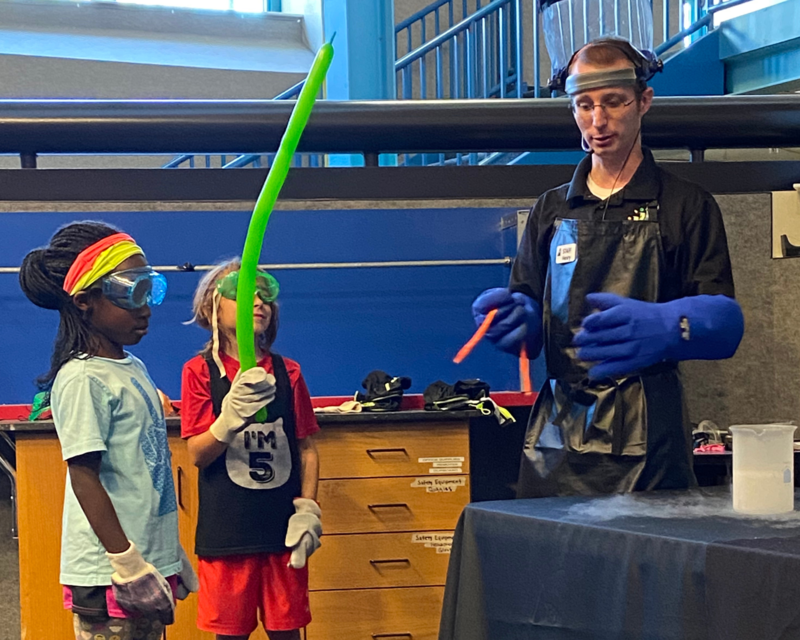 (L to R) Annabelle Williams, Peter Warren, and Science Central staff demonstrating states of matter